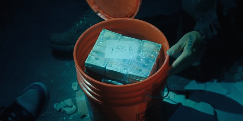 The Rip Ending Explained: How the Yellow Pages Swap and The Canary Trap Actually Worked 3 Orange Money bucket The rip movie
